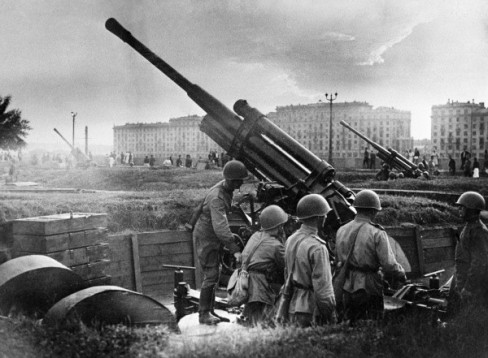 Defenders of Moscow during the WWII years getting in the Gorky Park AAA guns ready for repelling a mock German air attack