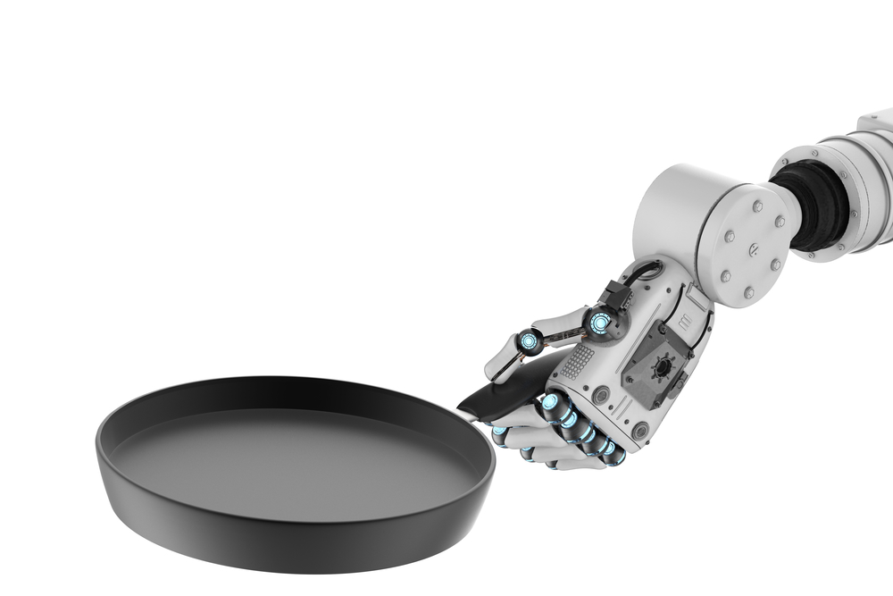 robot hand holding frying pan