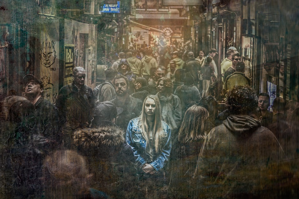 woman alone in crowd