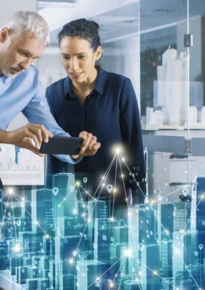 Male and Female Architects Work with Holographic Augmented Reality 3D City Model. Technologically Advanced Office Professional People Use Virtual Reality Modeling Software Application.