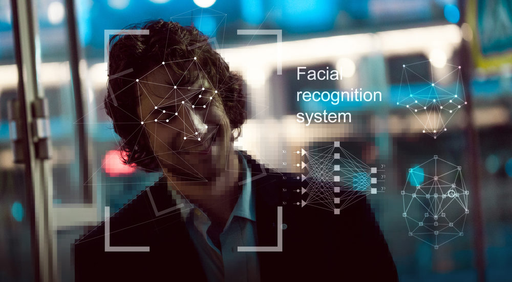 Facial recognition system, concept. Young man on the street face recognition