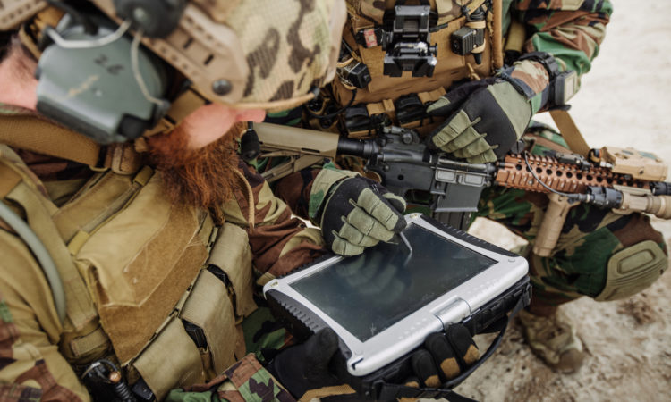 Army personnel working on technology