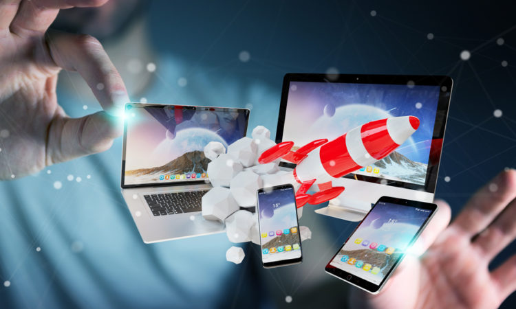 Businessman connecting tech devices and startup rocket 3D render
