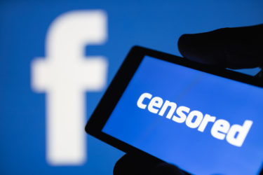 facebook censor qanon